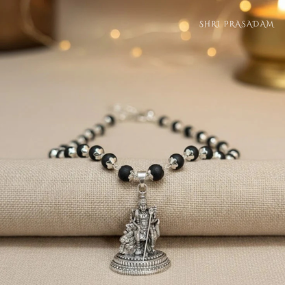 Karungali Mala (black ebony wood beads necklace) with a silver-plated Lord Murugan pendant.