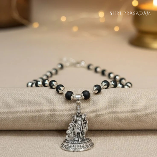 Karungali Mala (black ebony wood beads necklace) with a silver-plated Lord Murugan pendant.