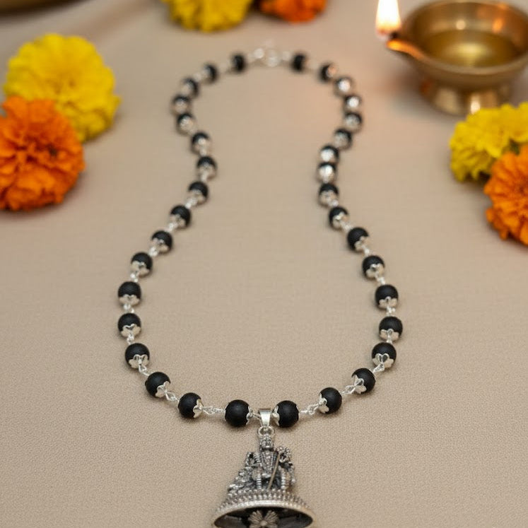 Karungali Mala (black ebony wood beads necklace) with a silver-plated Lord Murugan pendant.