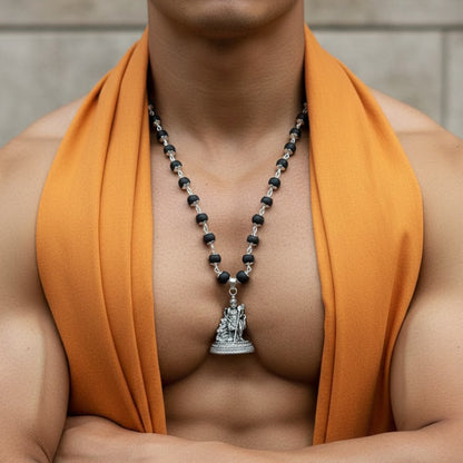 Karungali Mala (black ebony wood beads necklace) with a silver-plated Lord Murugan pendant.